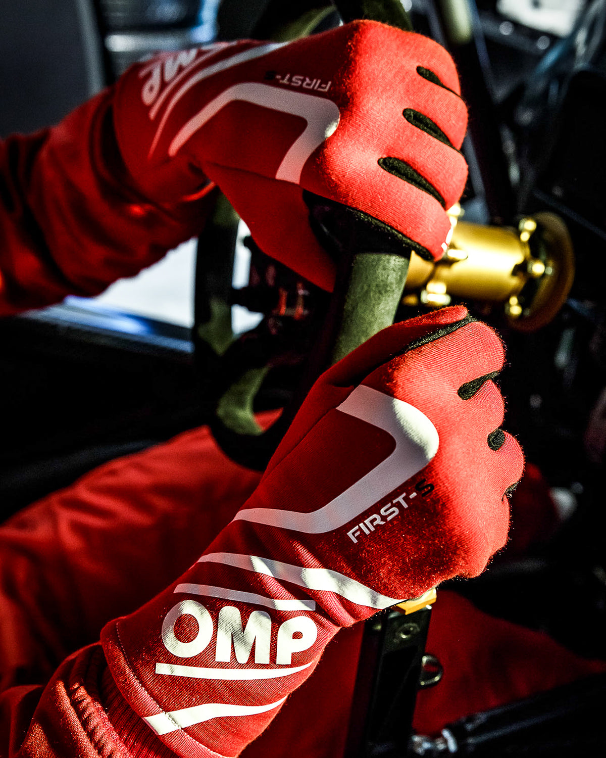Driver Holding the Steering Wheel With OMP Racing Gloves - Fast Racer