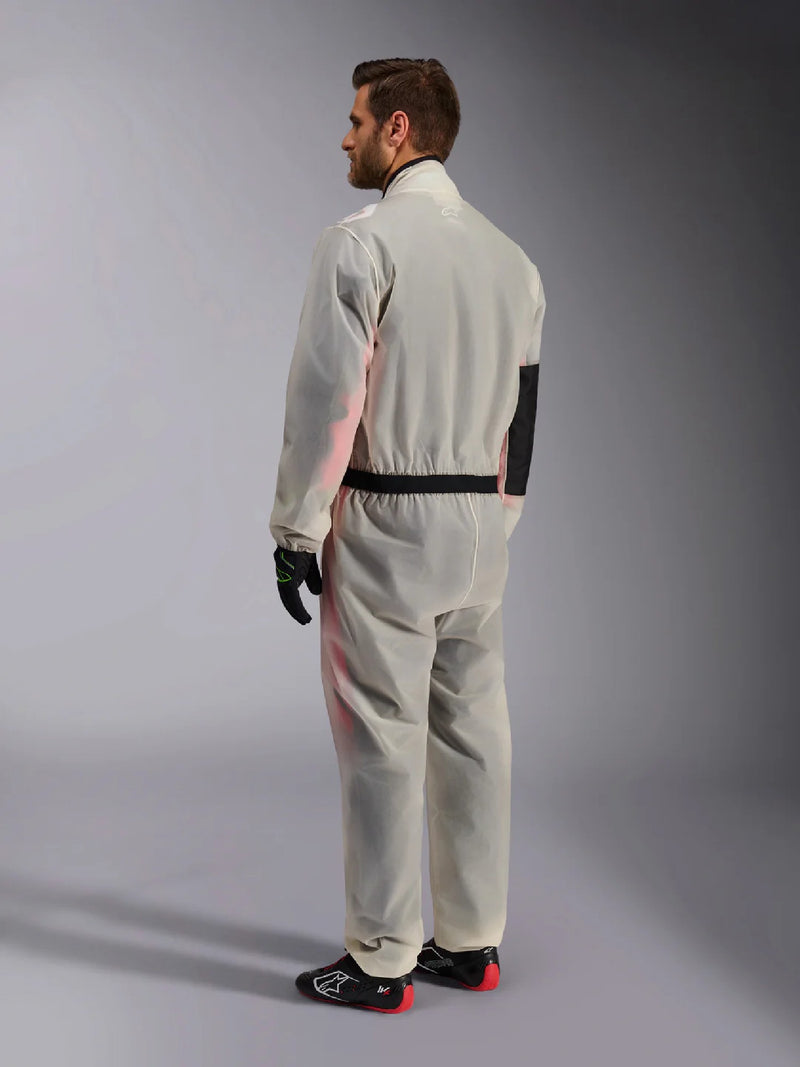 Side Back View of a Driver wearing the Alpinestars KART RAIN Suit - FAST RACER