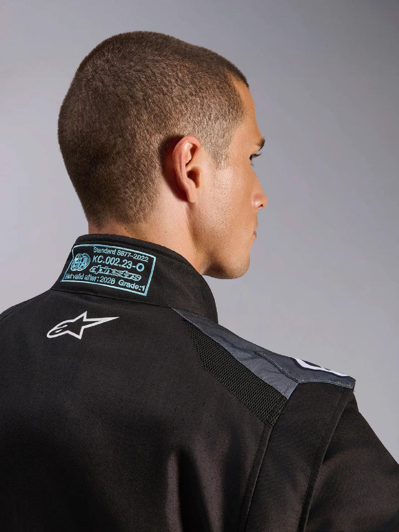 Close Up Back view of a driver wearing the Alpinestars KMX-5 V3 Kart Suit in Black Color at FAST RACER