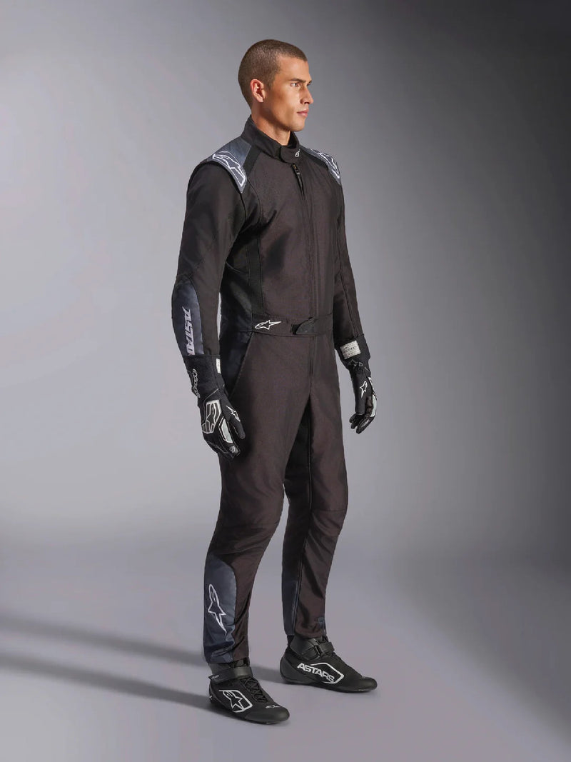 Side Right view of a driver wearing the Alpinestars KMX-5 V3 Kart Suit in Black Color at FAST RACER
