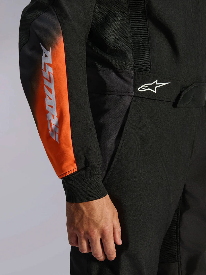 Close Up Arm view of a driver wearing the Alpinestars KMX-5 V3 Kart Suit in Orange/Black color at FAST RACER