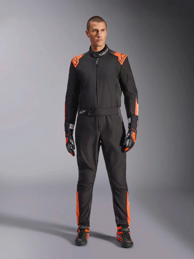Full Front view of a driver wearing the Alpinestars KMX-5 V3 Kart Suit in Orange/Black color at FAST RACER