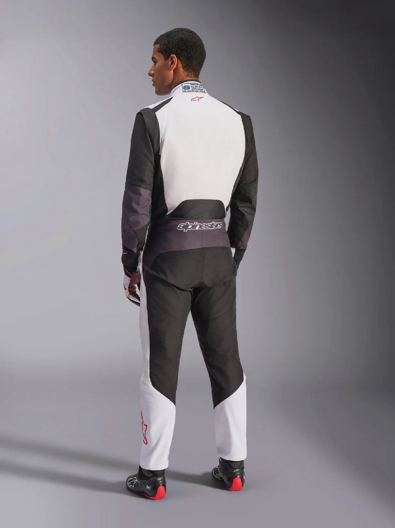 Side Back view of a driver wearing the Alpinestars KMX-5 V3 Kart Suit in White Color at FAST RACER