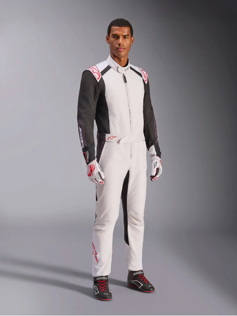 Side Right view of a driver wearing the Alpinestars KMX-5 V3 Kart Suit in White Color at FAST RACER