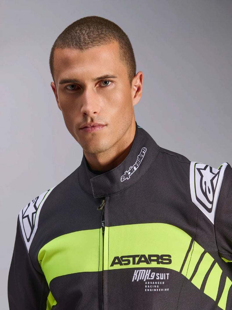 Close Up Front view of a driver wearing the Alpinestars KMX-9 V3 Graphic 3 Kart Suit in Black/Yellow color at FAST RACER