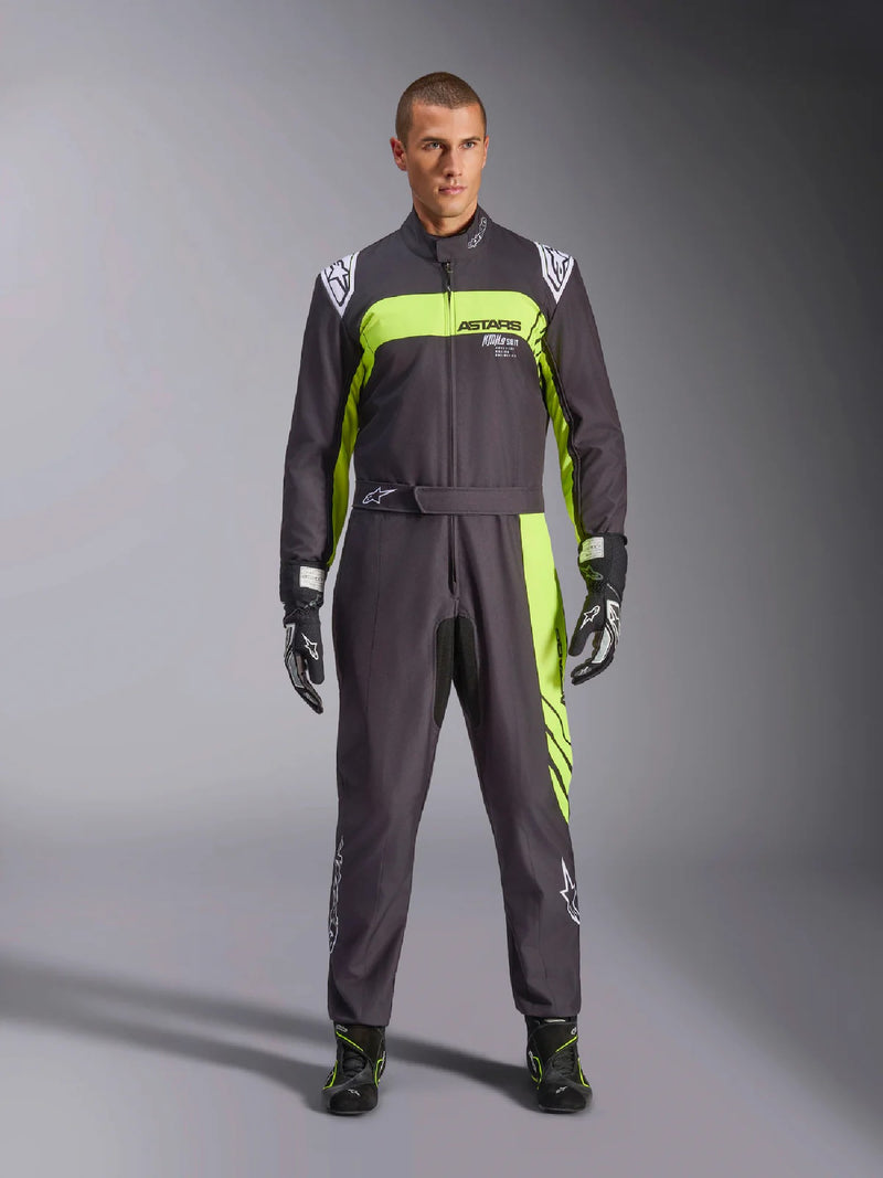 Full front view of a driver wearing the Alpinestars KMX-9 V3 Graphic 3 Kart Suit in Black/Yellow color at FAST RACER