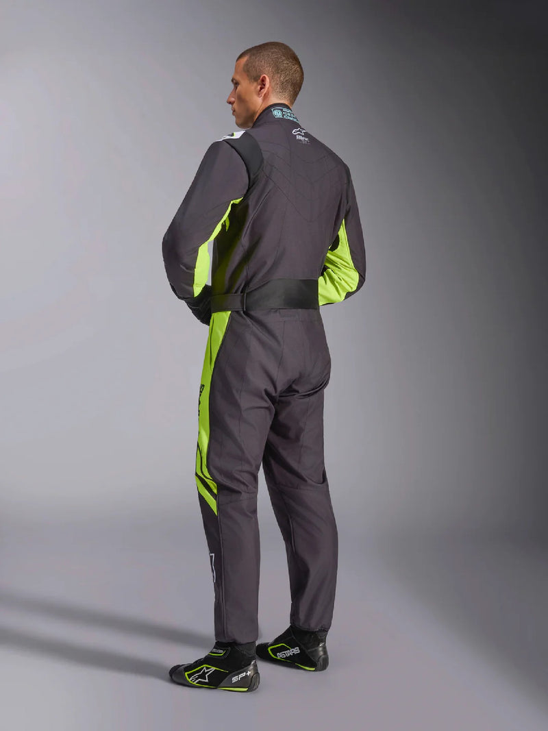 Side back view of a driver wearing the Alpinestars KMX-9 V3 Graphic 3 Kart Suit in Black/Yellow color at FAST RACER