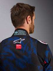 Close Up Back view of a driver wearing the Alpinestars KMX-9 V3 Graphic 5 Kart Suit in Navy Blue/Red color at FAST RACER