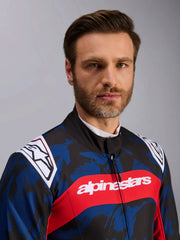 Close Up Front view of a driver wearing the Alpinestars KMX-9 V3 Graphic 5 Kart Suit in Navy Blue/Red color at FAST RACER