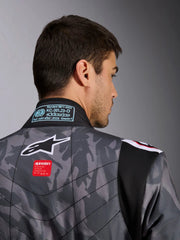 Close Up Back view of a driver wearing the Alpinestars KMX-9 V3 Graphic 5 Kart Suit in Dark Gray/Black color at FAST RACER