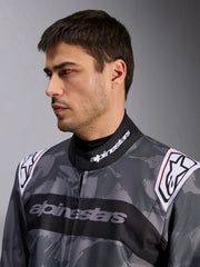 Close Up Front view of a driver wearing the Alpinestars KMX-9 V3 Graphic 5 Kart Suit in Dark Gray/Black color at FAST RACER
