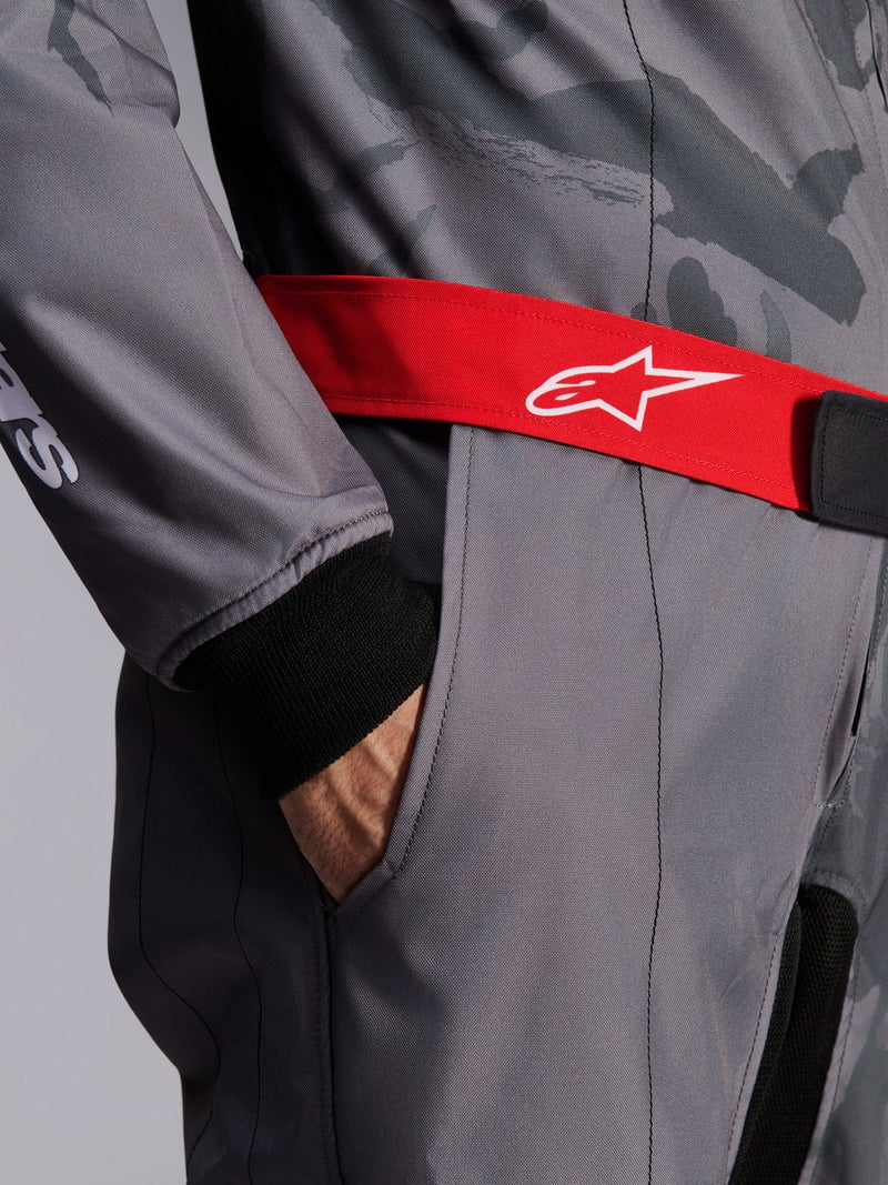 Close Up Arm view of a driver wearing the Alpinestars KMX-9 V3 Graphic 5 Kart Suit in Dark Gray/Black color at FAST RACER