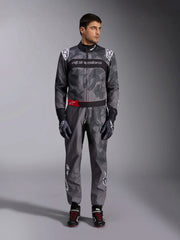 Full Front view of a driver wearing the Alpinestars KMX-9 V3 Graphic 5 Kart Suit in Dark Gray/Black color at FAST RACER