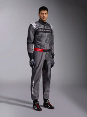 Side Right view of a driver wearing the Alpinestars KMX-9 V3 Graphic 5 Kart Suit in Dark Gray/Black color at FAST RACER