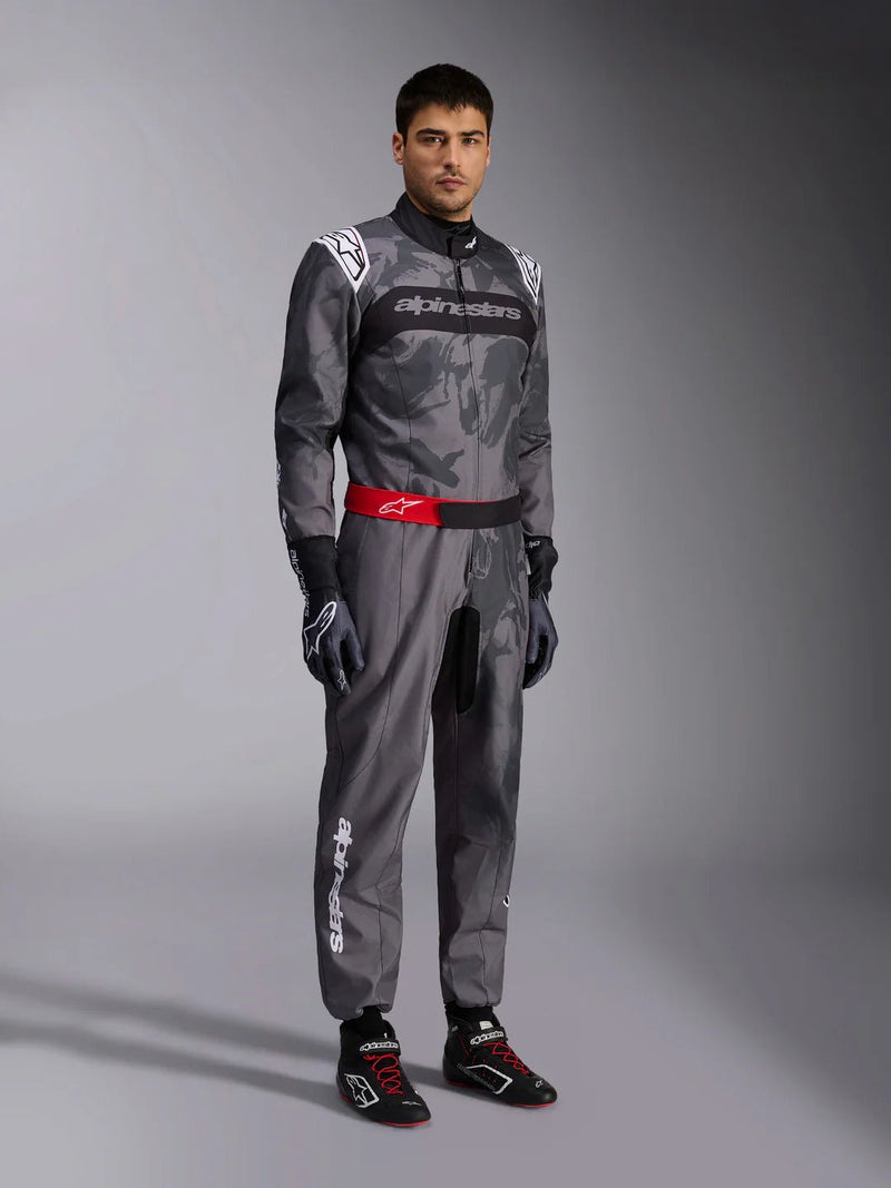 Side Right view of a driver wearing the Alpinestars KMX-9 V3 Graphic 5 Kart Suit in Dark Gray/Black color at FAST RACER