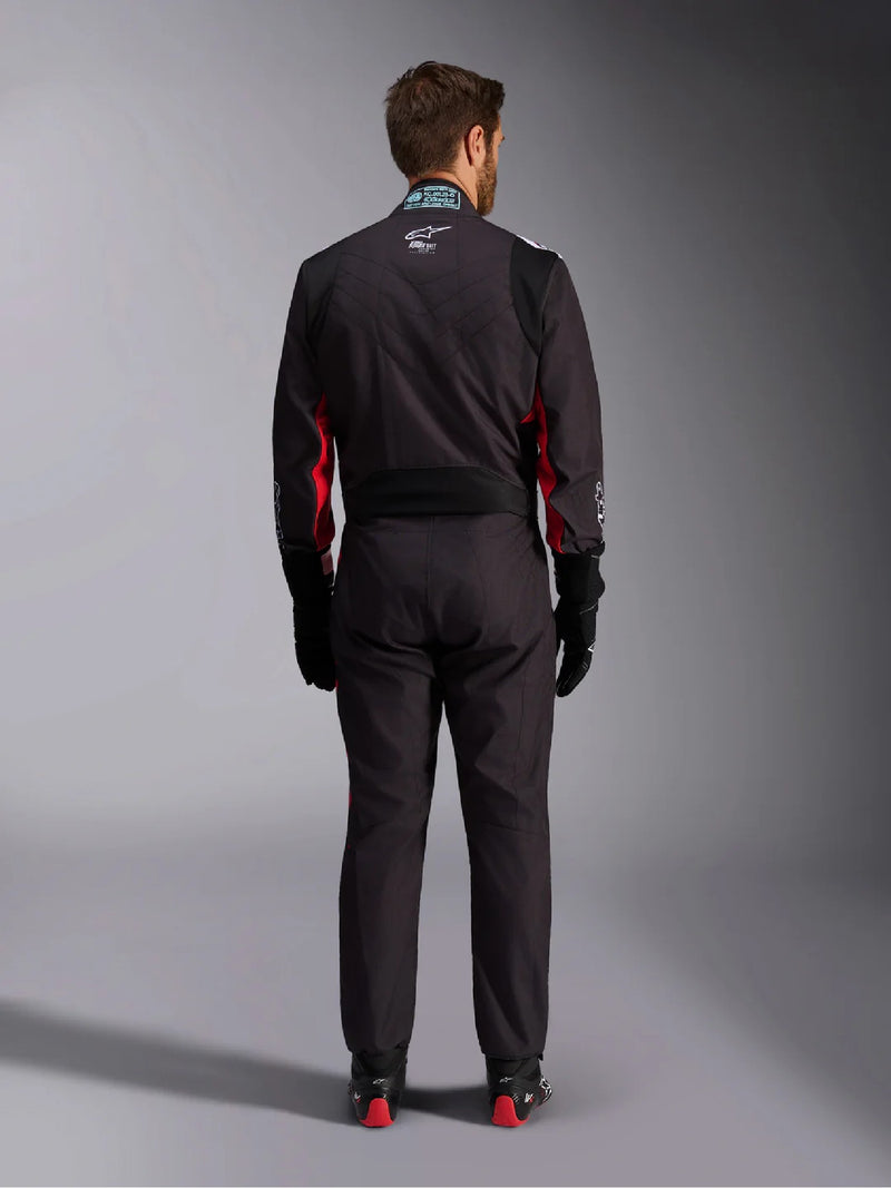 Full back view of a driver wearing the Alpinestars KMX-9 V3 Graphic 3 Kart Suit in Black/Red color at FAST RACER