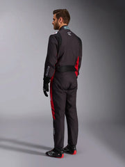 Side back view of a driver wearing the Alpinestars KMX-9 V3 Graphic 3 Kart Suit in Black/Red color at FAST RACER