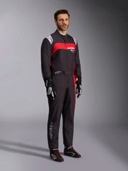 Side Right view of a driver wearing the Alpinestars KMX-9 V3 Graphic 3 Kart Suit in Black/Red color at FAST RACER