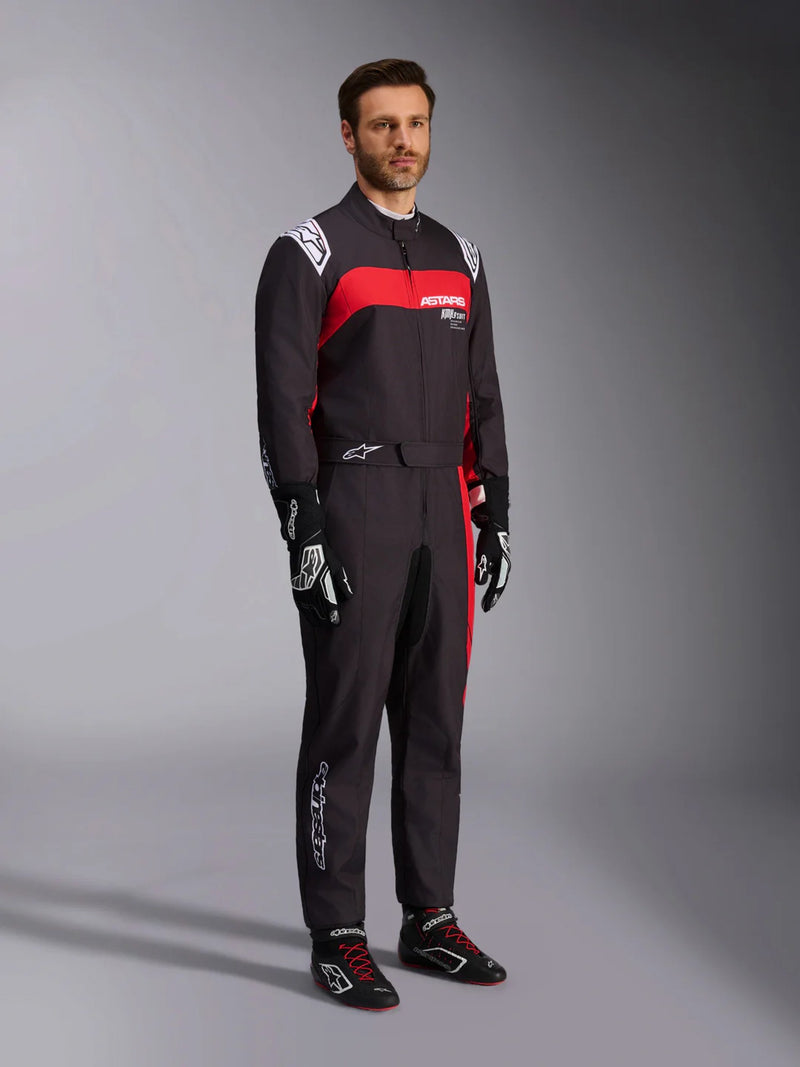 Side Right view of a driver wearing the Alpinestars KMX-9 V3 Graphic 3 Kart Suit in Black/Red color at FAST RACER