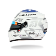 Side view of Alex Albon’s 2026 F1 Bell mini helmet with Atlassian, Duracell, Albon, Wilkinson Sword, and Estrella Galicia graphics - Fast Racer