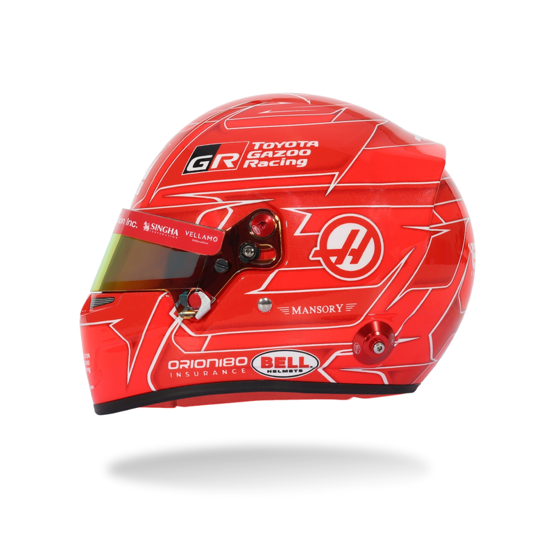 Side view of Esteban Ocon’s red 2026 F1 Bell mini helmet with Haas, Toyota Gazoo Racing, and number 40 graphics - Fast Racer