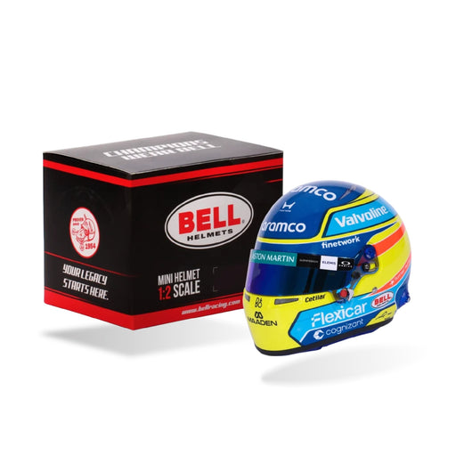 Front three-quarter view of Fernando Alonso's 2026 Aston Martin F1 Bell 1:2 scale mini helmet with Bell retail box - FAST RACER