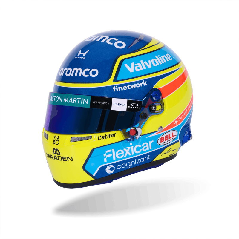 Side view of Fernando Alonso’s 2026 F1 Bell mini helmet with Valvoline, Flexicar, and Aston Martin sponsor graphics - Fast Racer