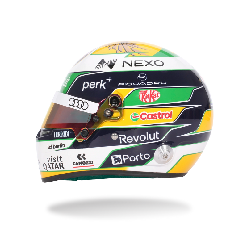 Front view of Gabriel Bortoleto’s 2026 F1 Bell mini helmet with a tinted visor, green, yellow, white, and black graphics - Fast Racer