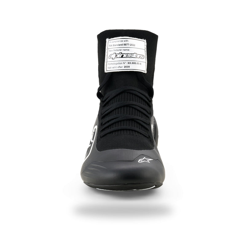 Alpinestars Supertech K karting shoe in Black/White, front view with black laces and FIA label on tongue