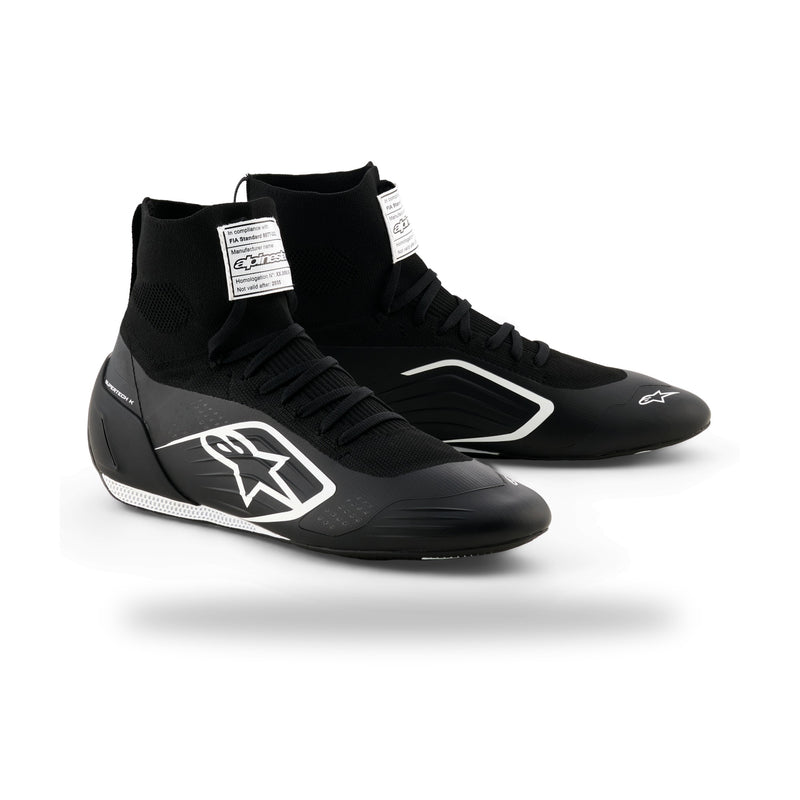Alpinestars Supertech K karting shoe in Black/White, three-quarter view with white side logo and FIA label on tongue