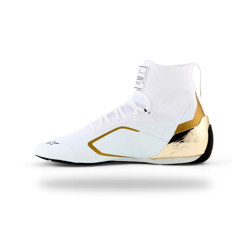 Alpinestars Supertech K karting shoe in White/Black/Gold, right side view with gold heel counter and side accents