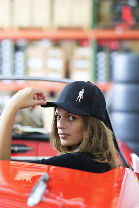 Woman wearing a Racing Spirit Icon Unisex Hat - Racing Cap - Black - RS/C/0002/071 - Fast Racer